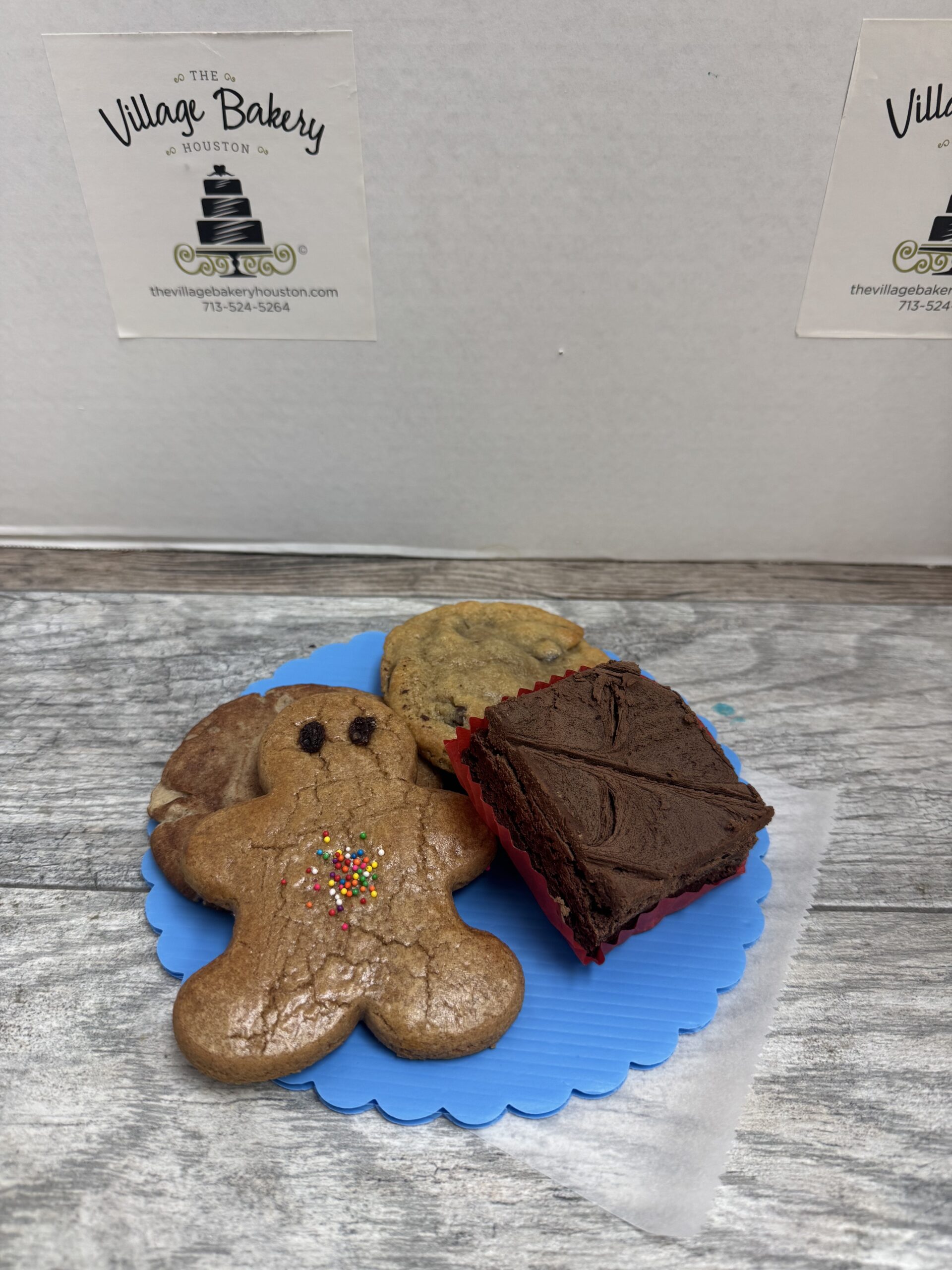 An assortment of The Village Bakery's Cookies -- Gingerbread man, Snickerdoodle, chocolate chip, and a brownie
